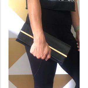 Black clutch bag with detachable chain